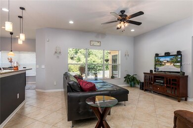 Great room with large windows overlooking the pati