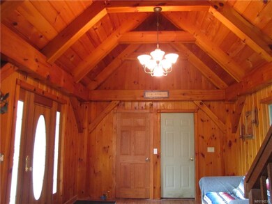 View of entryway (left) and door to garage