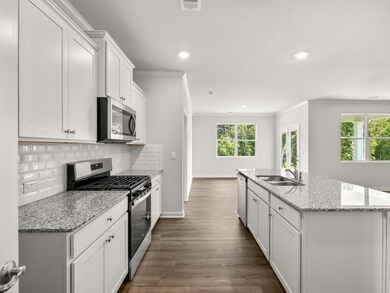 Aria kitchen with granite countertops and stainless steel appliances