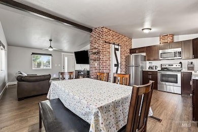 Dining area featuring a ceiling fan and wood finished floors
