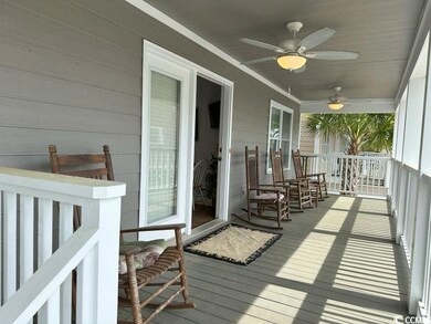 Wooden deck featuring ceiling fan