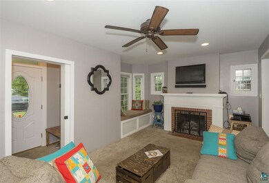 Chimney, carpet, and cute front entry with hideawa