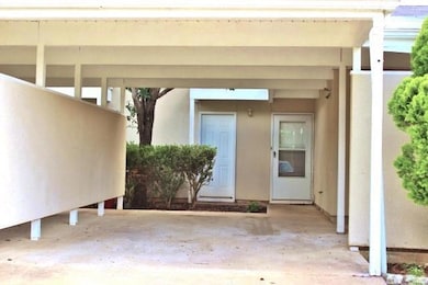 Doorway to property with stucco siding