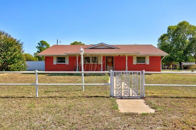 Ranch-style home with a front lawn