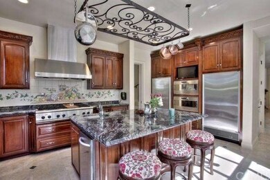 Gourmet chef kitchen featuring 2 Gaggenau ovens