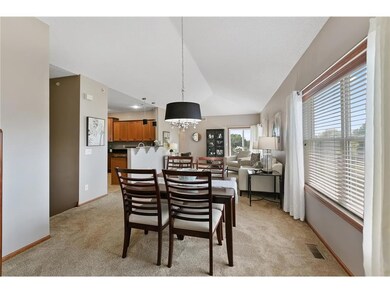 High ceilings and updated lighting in the dining r
