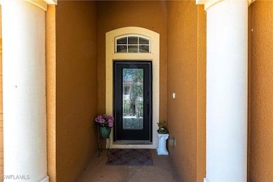 Doorway to property with stucco siding
