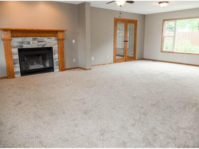 Great room with a beautiful fireplace and picture 