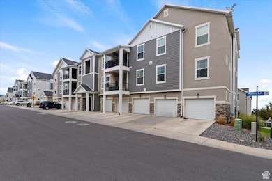 Front of Bldg, End Garage and Stairway to Unit featuring residential view