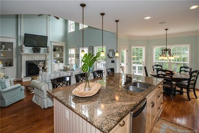 Oversize kitchen island opens to the family room