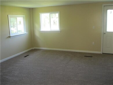 Living Room New widows & doors, and carpet & trim