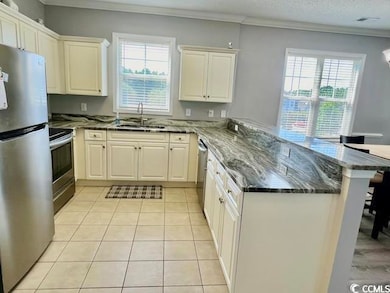 Kitchen with stainless steel appliances, crown mol