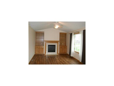 Family Room. Vaulted family room features a gas fi