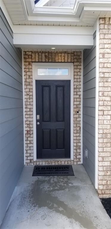 Front covered entry with video doorbell.