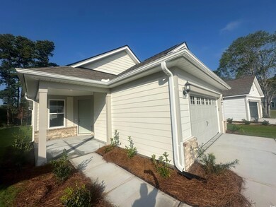 View of side of home featuring a garage