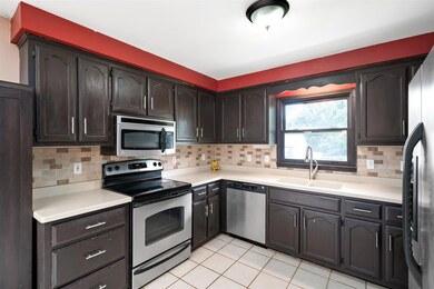 Stainless Steel Appliances, Tile Backsplash, and Breakfast Nook