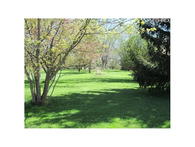 2.13 acres of beautiful plantings, level, great fo