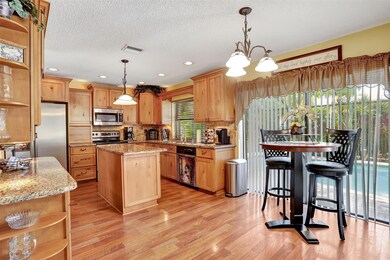 The spacious kitchen has abundant storage and coun