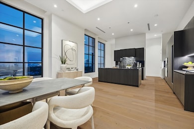 The dining area is seamlessly connected to the kitchen highlighting the home's open design, where every detail is thoughtfully crafted.
