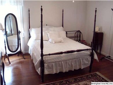 FIRST BEDROOM HAS BEAUTIFUL HARDWOOD FLOORS