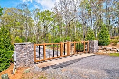 View of gate featuring fence