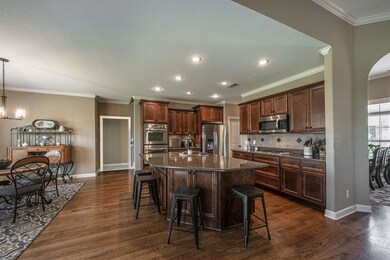 Kitchen featuring a center island with sink, penda