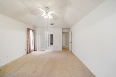 Another view of the primary bedroom