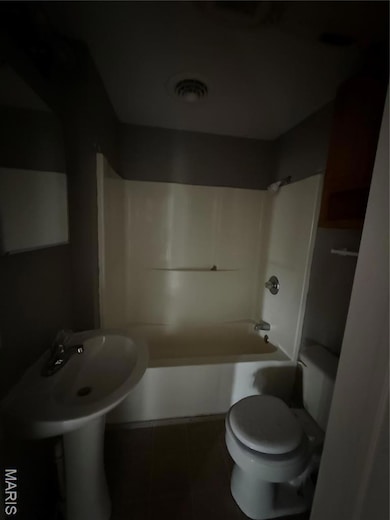 Full bathroom with  shower combination and tile patterned flooring