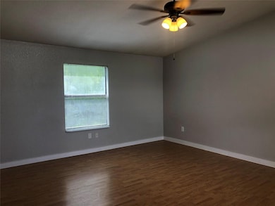 Here is another view of the living room with a lig