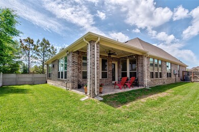 A nice-sized backyard is easily maintained with a built in sprinkler system. Look at the charming tiled back patio!