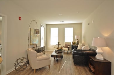 Living area featuring hardwood / wood-style floori