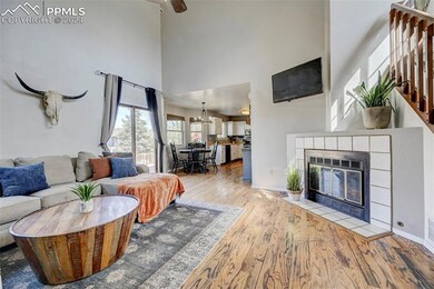 The living room, dining area, and kitchen flow eff
