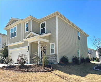 View of home's exterior with a garage and brick siding