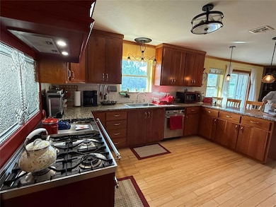 Kitchen featuring backsplash, crown molding, visib