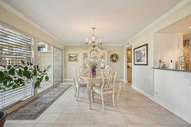 Dining area featuring baseboards, light tile patt