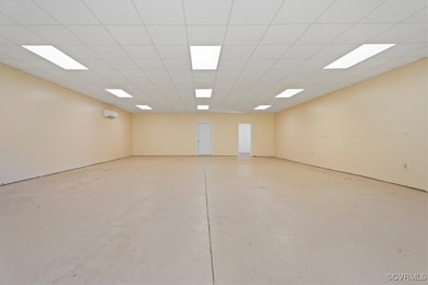Empty room featuring concrete floors