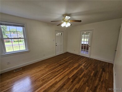 Unfurnished room featuring dark wood-type flooring