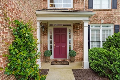 Doorway to property with brick siding