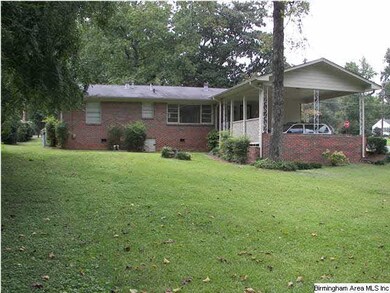 View of the large backyard and back of the house w