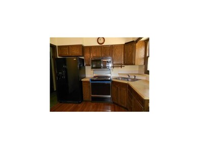 Kitchen. New flooring highlights this bright eat i
