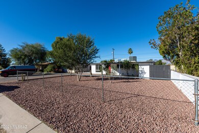 Fenced and landscaped front yard.
