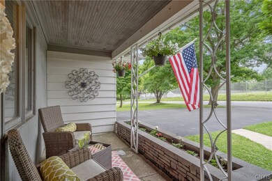 Pretty front porch with stone planter
