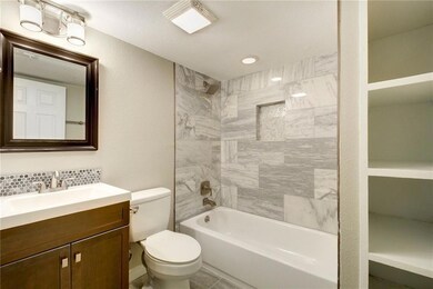 Bathroom with toilet, vanity, bathing tub / showe