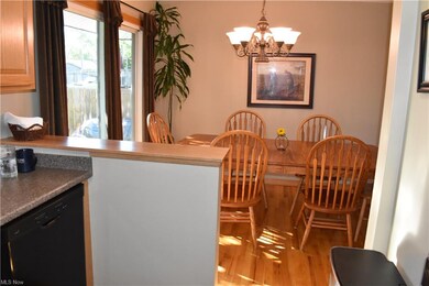 Dining room overlooks spacious fenced back yard.