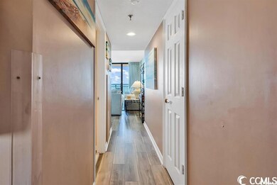 Hall with light hardwood / wood-style flooring