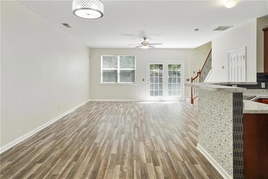 Unfurnished living room featuring a ceiling fan, v
