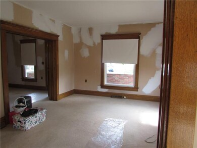Living room with French doors to foyer