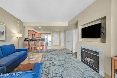 Living room featuring a tiled fireplace and recess