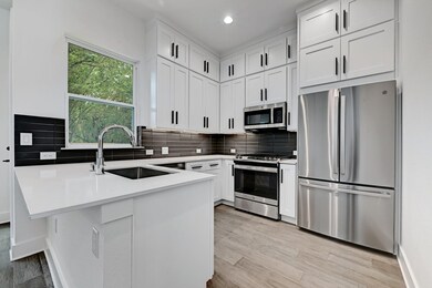 Kitchen featuring a sink, appliances with stainle