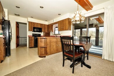 This informal dining area overlooks the kitchen, b